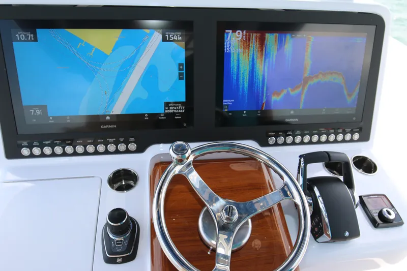  Yacht Photos Pics Helm of 2026 Bahama 41 GT with dual Garmin displays and steering wheel.