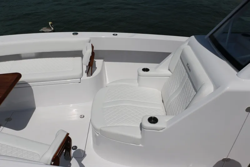  Yacht Photos Pics Luxurious seating on 2026 Bahama 41 GT boat with elegant white upholstery.