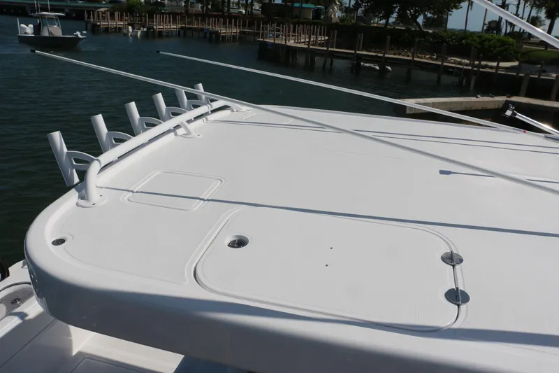  Yacht Photos Pics 2026 Bahama 41 GT boat deck with rod holders, docked in marina.