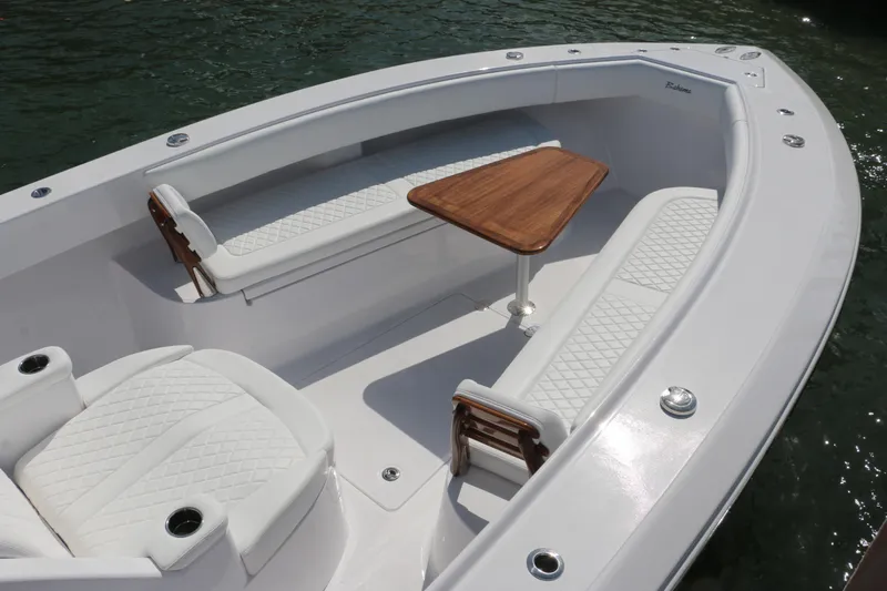  Yacht Photos Pics Luxurious seating area on 2026 Bahama 41 GT boat with elegant wood table.