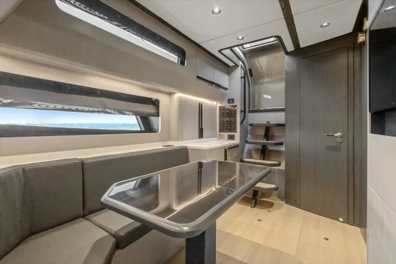  Yacht Photos Pics Luxurious interior of 2027 Canados Gladiator 571 Blade yacht with modern seating and sleek design.