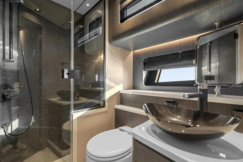  Yacht Photos Pics Luxurious bathroom interior of 2027 Canados Gladiator 571 Blade yacht, featuring modern fixtures and elegant design.