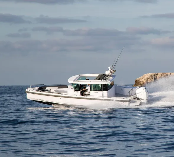  Yacht Photos Pics Axopar 28 CABIN 2022 cruising at high speed on open water.