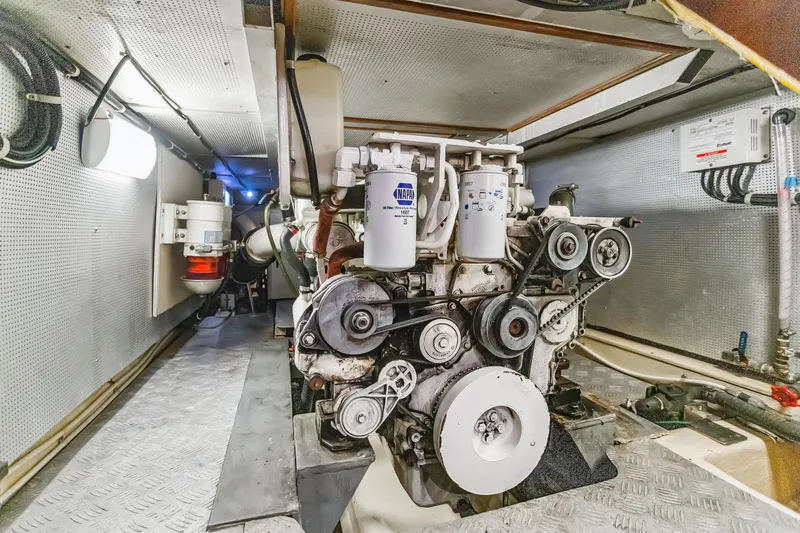 Seabatical Yacht Photos Pics Engine room of 2008 North Pacific 43 Pilothouse yacht, showcasing mechanical components and systems.