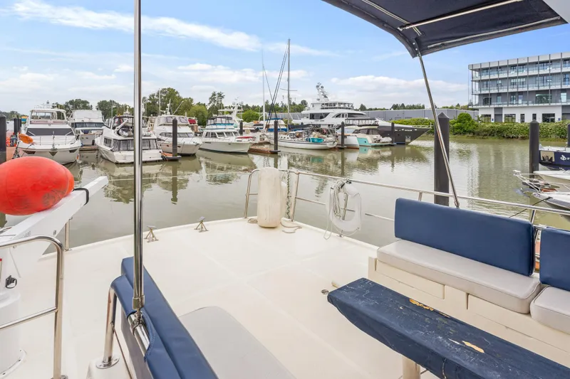 Seabatical Yacht Photos Pics 2008 North Pacific 43 Pilothouse yacht docked in a marina with other boats.