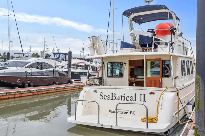 Seabatical Yacht Photos Pics North Pacific 43 Pilothouse yacht docked in marina, Vancouver, BC, 2008 model.