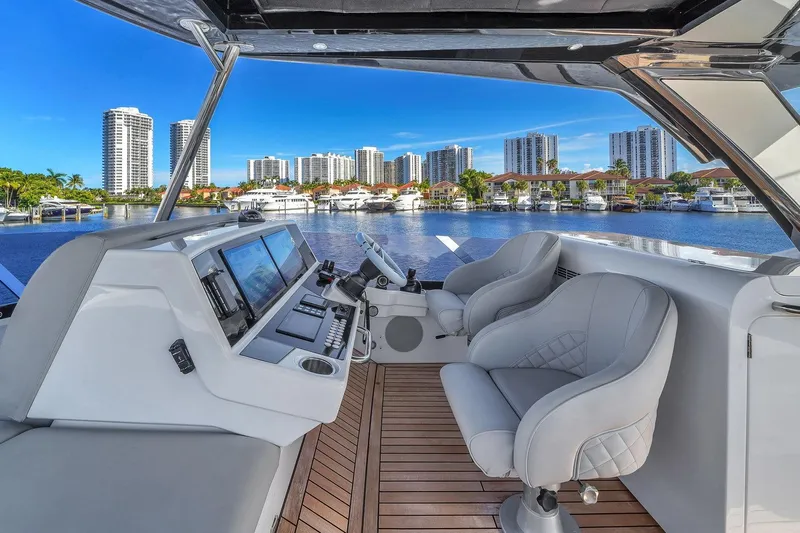 Rani Yacht Photos Pics Luxurious 2023 Sunseeker Manhattan 68 Pacific yacht interior with waterfront cityscape view.