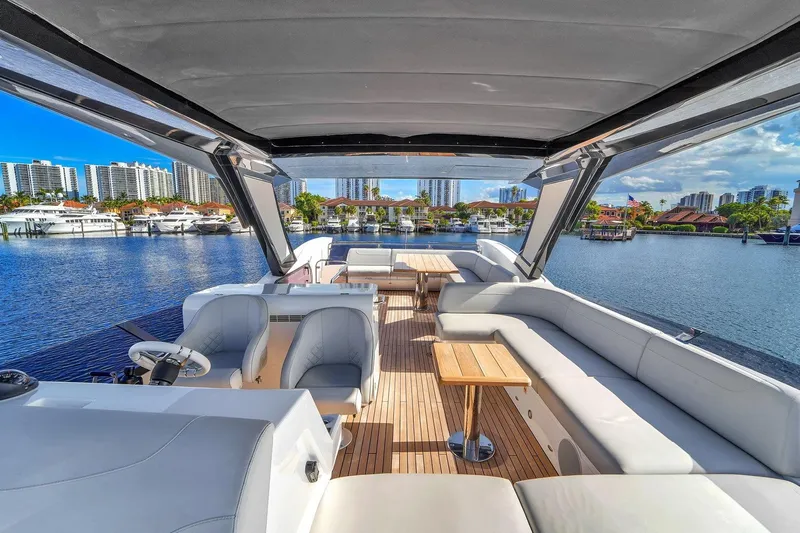 Rani Yacht Photos Pics Luxurious 2023 Sunseeker Manhattan 68 Pacific yacht interior with spacious seating and scenic marina view.