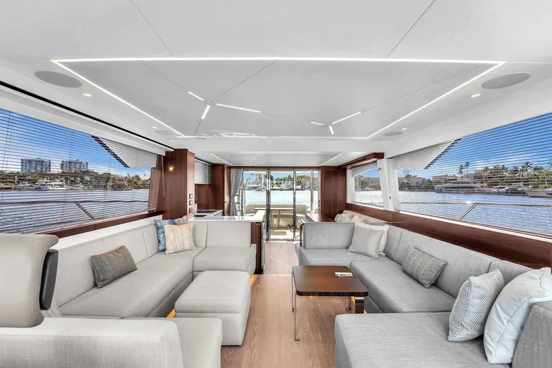 Rani Yacht Photos Pics Luxurious interior of 2023 Sunseeker Manhattan 68 Pacific yacht with modern seating and panoramic windows.