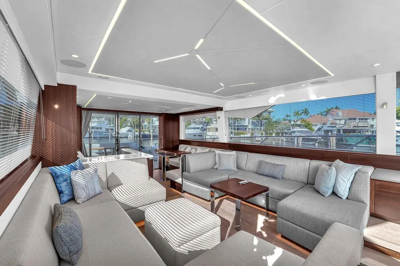 Rani Yacht Photos Pics Luxurious interior of 2023 Sunseeker Manhattan 68 Pacific yacht with modern seating and large windows.
