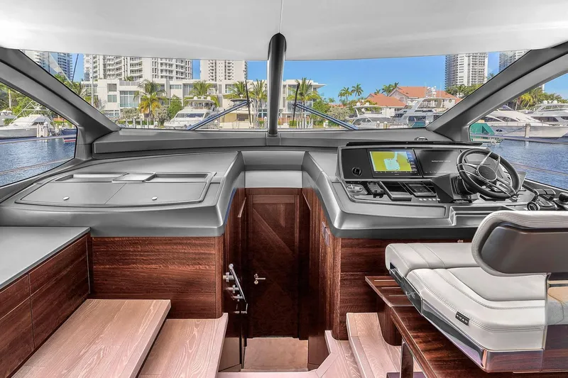 Rani Yacht Photos Pics Luxurious 2023 Sunseeker Manhattan 68 Pacific yacht interior with modern helm and waterfront view.