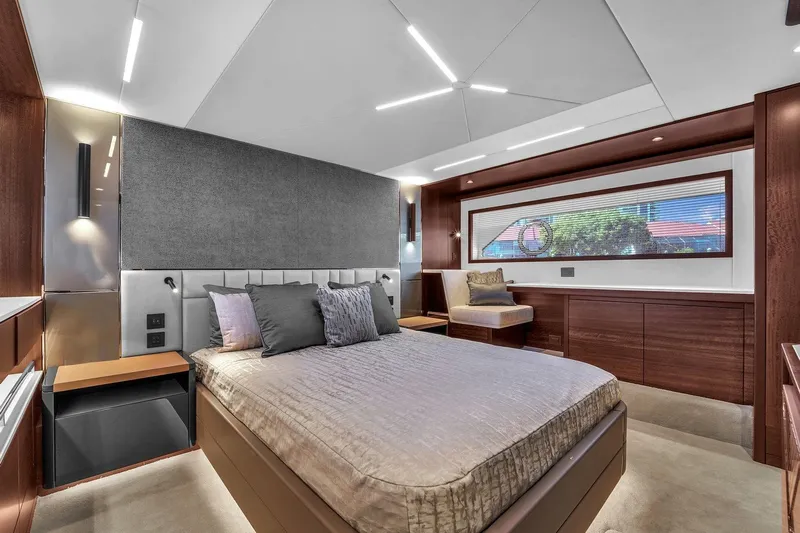 Rani Yacht Photos Pics Luxurious bedroom interior of 2023 Sunseeker Manhattan 68 Pacific yacht, featuring modern design.