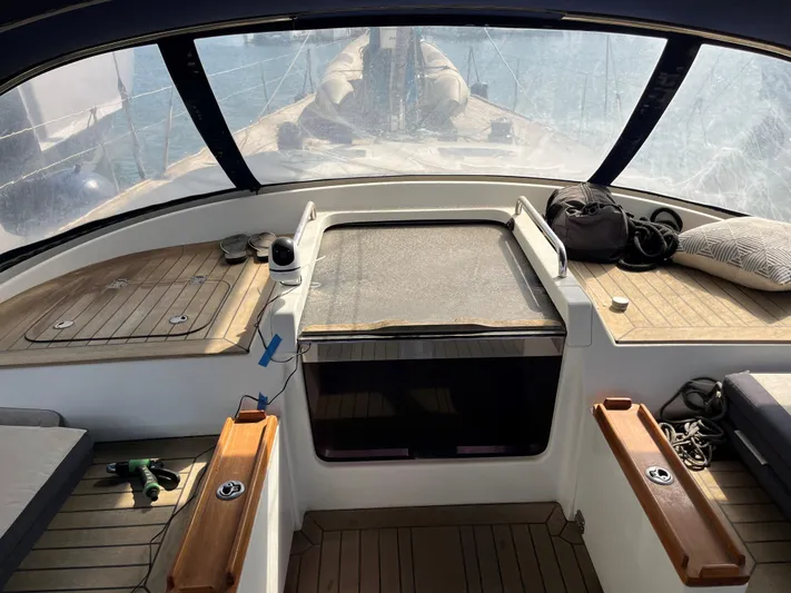 Alchemy IV Yacht Photos Pics Cockpit view of 2009 Nautor Swan 82S yacht with teak flooring and seating.