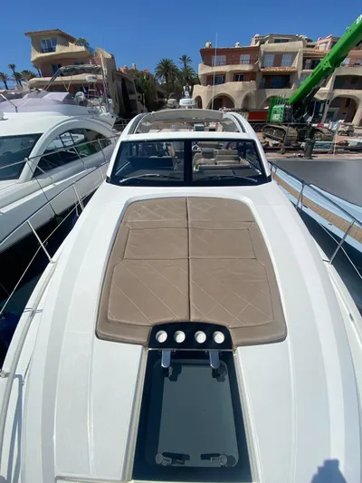  Yacht Photos Pics 2018 Fairline Targa 48 Open yacht with sunpad, docked in a marina.