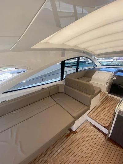  Yacht Photos Pics 2018 Fairline Targa 48 Open yacht interior with sleek seating and wooden flooring.