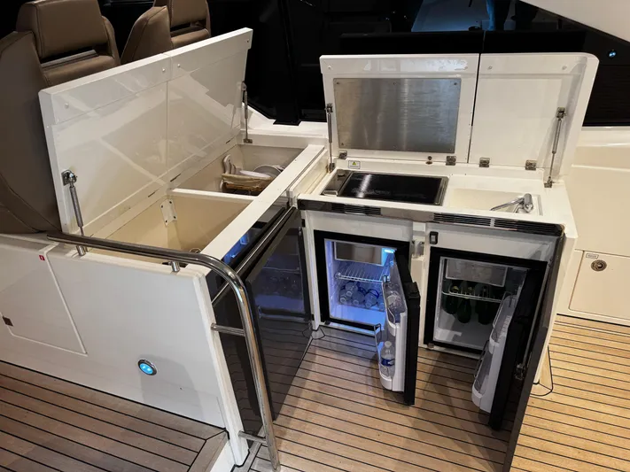  Yacht Photos Pics 2018 Fairline Targa 48 Open yacht with open deck kitchen, featuring grill and refrigerators.