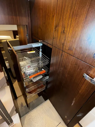  Yacht Photos Pics Pull-out wire storage rack in 2018 Fairline Targa 48 Open yacht interior.