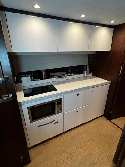  Yacht Photos Pics 2018 Fairline Targa 48 Open yacht kitchen with modern appliances and sleek cabinetry.