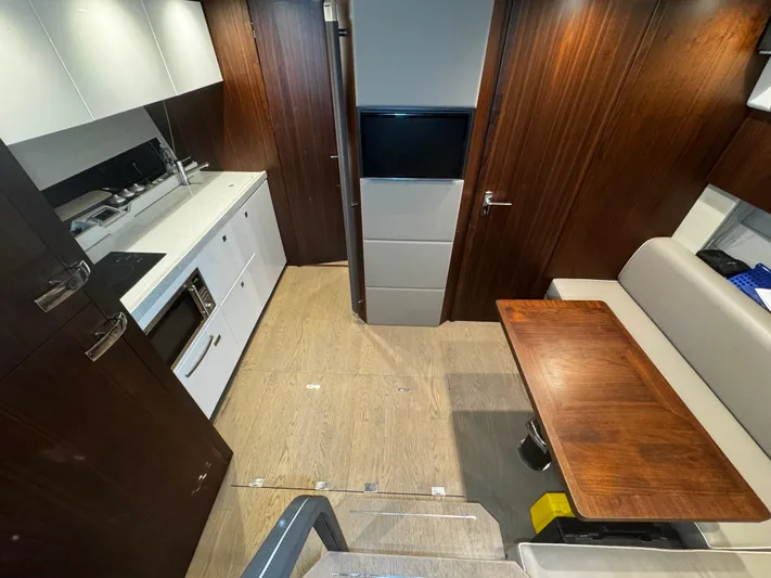  Yacht Photos Pics 2018 Fairline Targa 48 Open interior with modern kitchen and dining area.