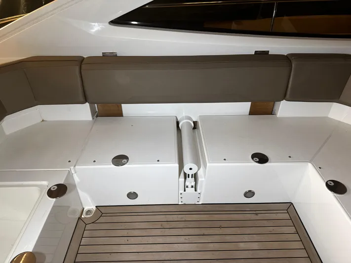  Yacht Photos Pics 2018 Fairline Targa 48 Open yacht interior with cushioned seating and wooden flooring.