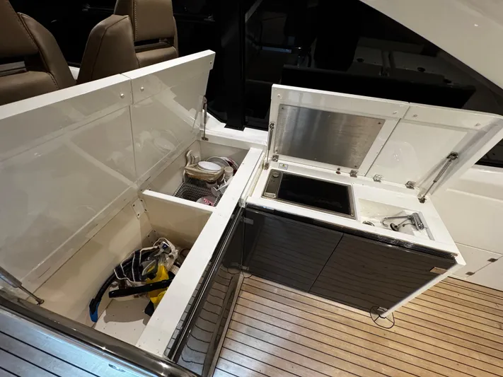  Yacht Photos Pics 2018 Fairline Targa 48 Open yacht kitchen area with storage and cooking facilities.
