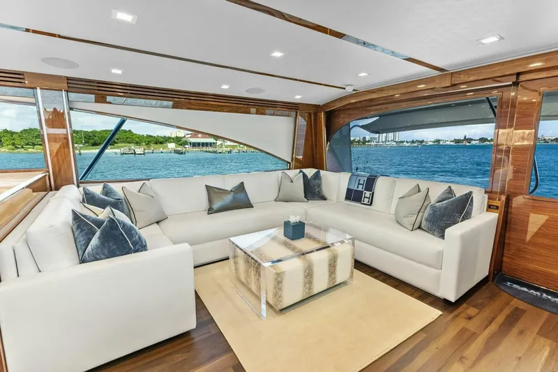 Team Harvey Yacht Photos Pics Luxurious interior of 2026 Viking 82 Convertible yacht with elegant seating and ocean view.