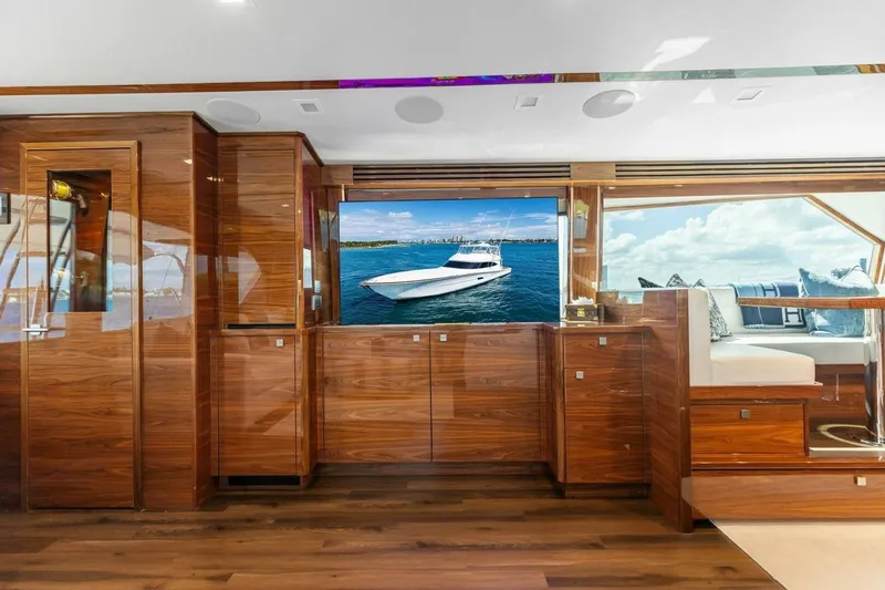 Team Harvey Yacht Photos Pics Luxurious interior of 2026 Viking 82 Convertible yacht with polished wood finishes.