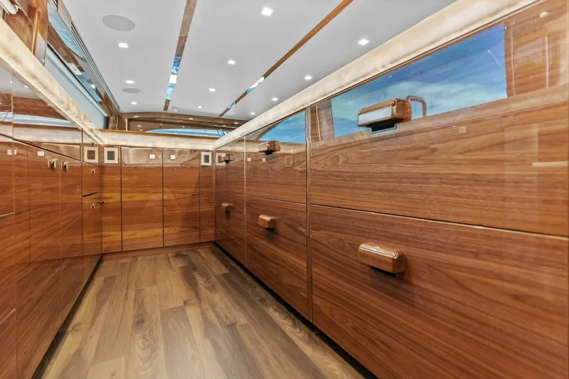 Team Harvey Yacht Photos Pics Luxurious wooden interior of 2026 Viking 82 Convertible yacht, featuring sleek cabinetry and modern design.