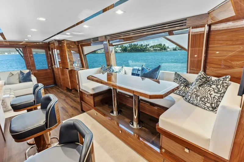Team Harvey Yacht Photos Pics Luxurious interior of 2026 Viking 82 Convertible yacht with elegant seating and ocean view.