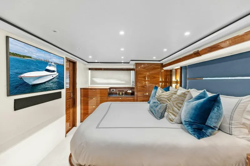 Team Harvey Yacht Photos Pics Luxurious bedroom interior of 2026 Viking 82 Convertible yacht with elegant decor and modern amenities.