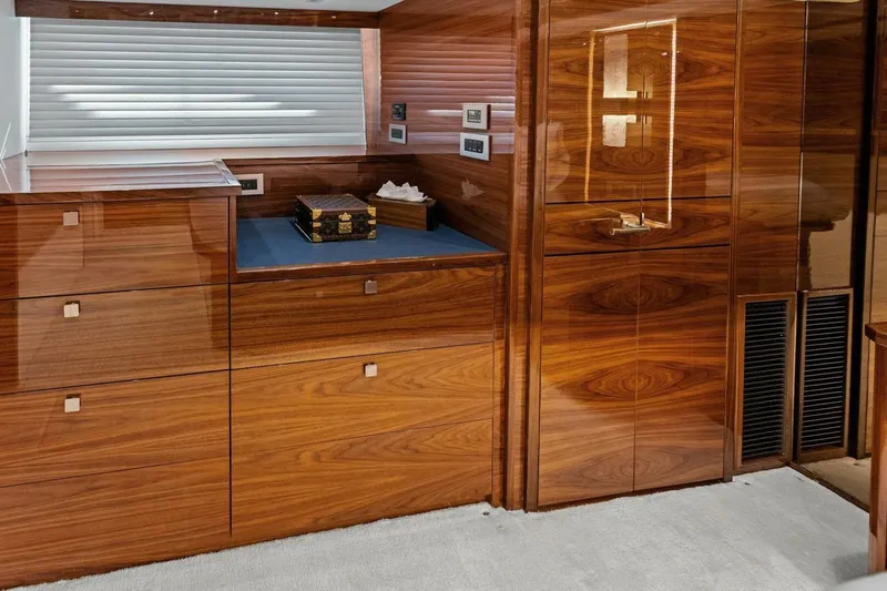 Team Harvey Yacht Photos Pics Luxurious wood interior of 2026 Viking 82 Convertible yacht cabin.