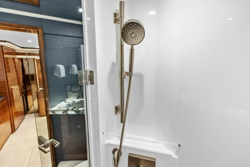 Team Harvey Yacht Photos Pics Luxurious shower in 2026 Viking 82 Convertible yacht bathroom.