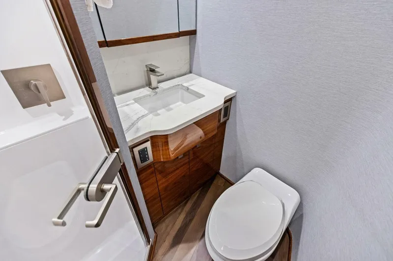 Team Harvey Yacht Photos Pics Luxury bathroom in 2026 Viking 82 Convertible yacht with modern fixtures and elegant design.