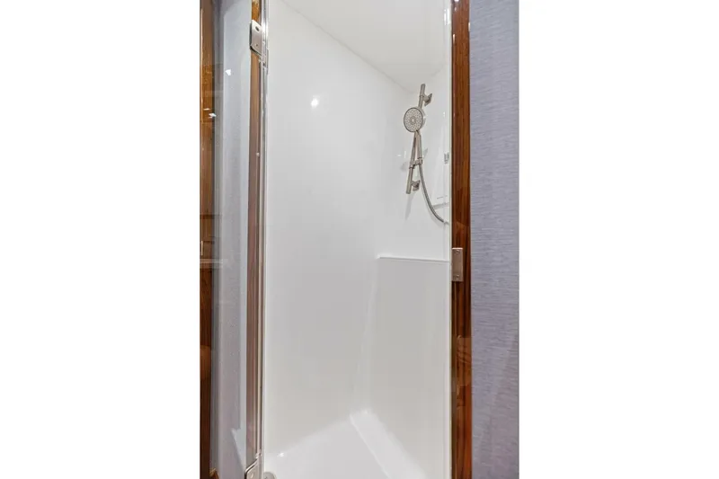 Team Harvey Yacht Photos Pics Shower area in 2026 Viking 82 Convertible yacht, featuring sleek design and modern fixtures.