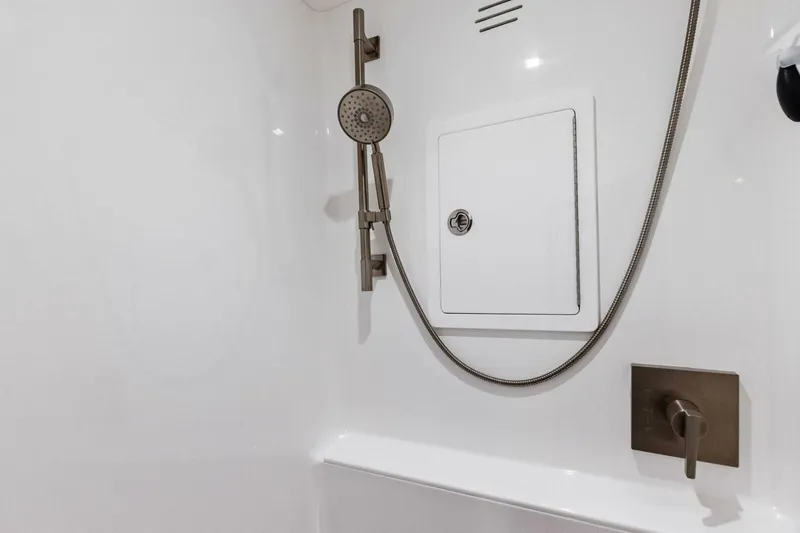 Team Harvey Yacht Photos Pics Modern shower in 2026 Viking 82 Convertible yacht bathroom.