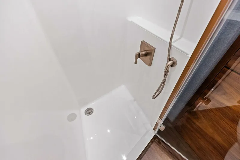 Team Harvey Yacht Photos Pics Shower area in 2026 Viking 82 Convertible yacht with modern fixtures.