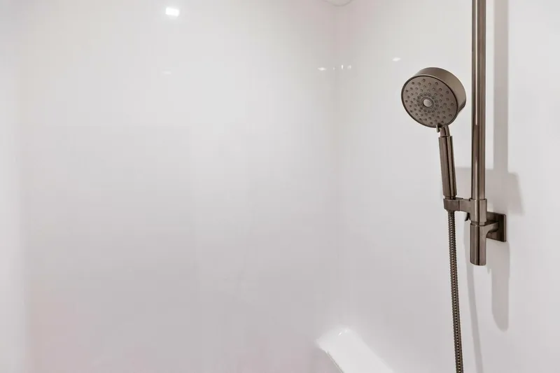 Team Harvey Yacht Photos Pics Modern showerhead in 2026 Viking 82 Convertible yacht bathroom.