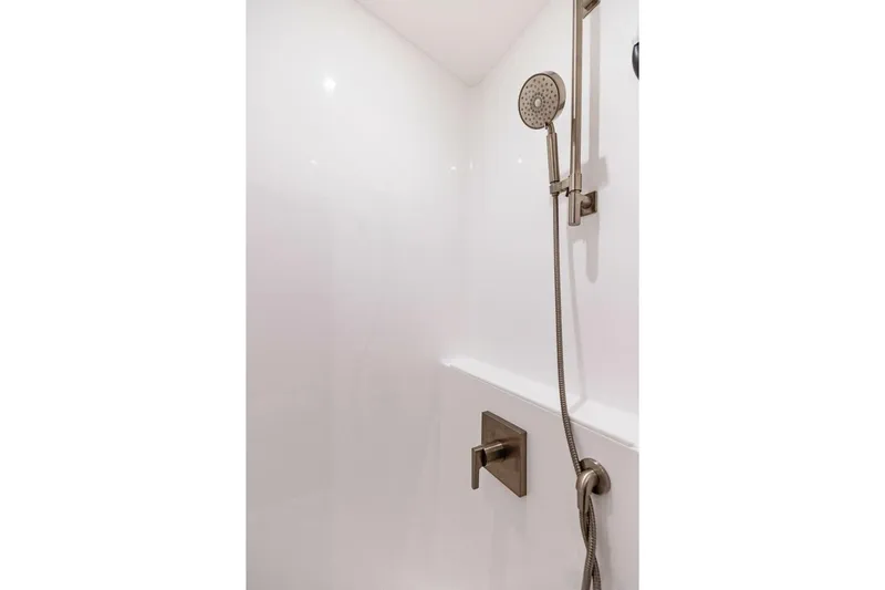 Team Harvey Yacht Photos Pics Modern shower in 2026 Viking 82 Convertible yacht bathroom.