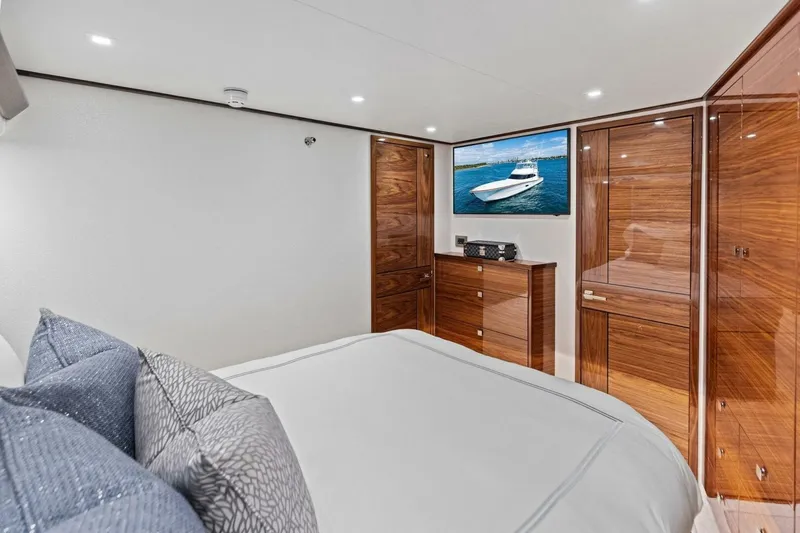 Team Harvey Yacht Photos Pics Luxurious cabin interior of 2026 Viking 82 Convertible yacht with elegant wood finishes.