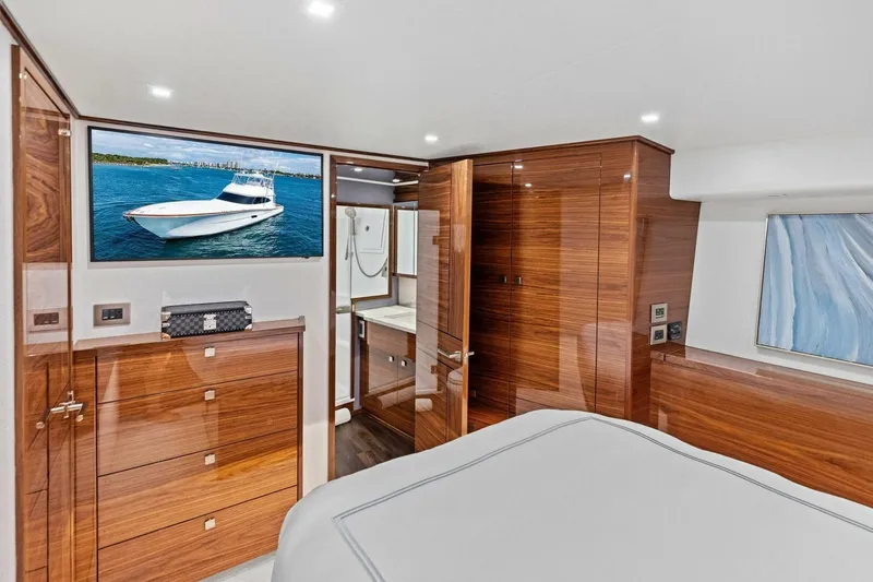 Team Harvey Yacht Photos Pics Luxurious interior of 2026 Viking 82 Convertible yacht with wood finishes and modern amenities.