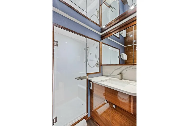 Team Harvey Yacht Photos Pics Luxurious bathroom in 2026 Viking 82 Convertible yacht with modern fixtures and elegant design.
