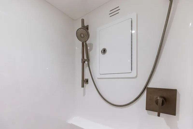 Team Harvey Yacht Photos Pics Shower area in 2026 Viking 82 Convertible yacht with modern fixtures.