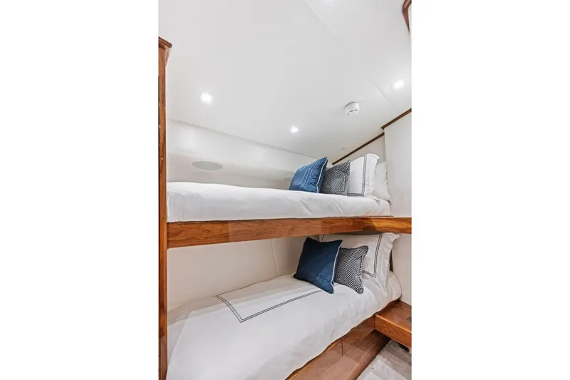 Team Harvey Yacht Photos Pics Bunk beds in 2026 Viking 82 Convertible yacht cabin with cozy pillows.