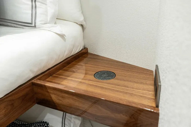 Team Harvey Yacht Photos Pics Wooden bedside table in 2026 Viking 82 Convertible yacht cabin.