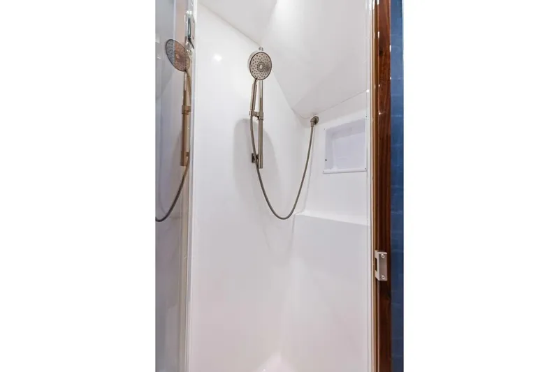 Team Harvey Yacht Photos Pics Shower area in 2026 Viking 82 Convertible yacht, featuring modern fixtures.