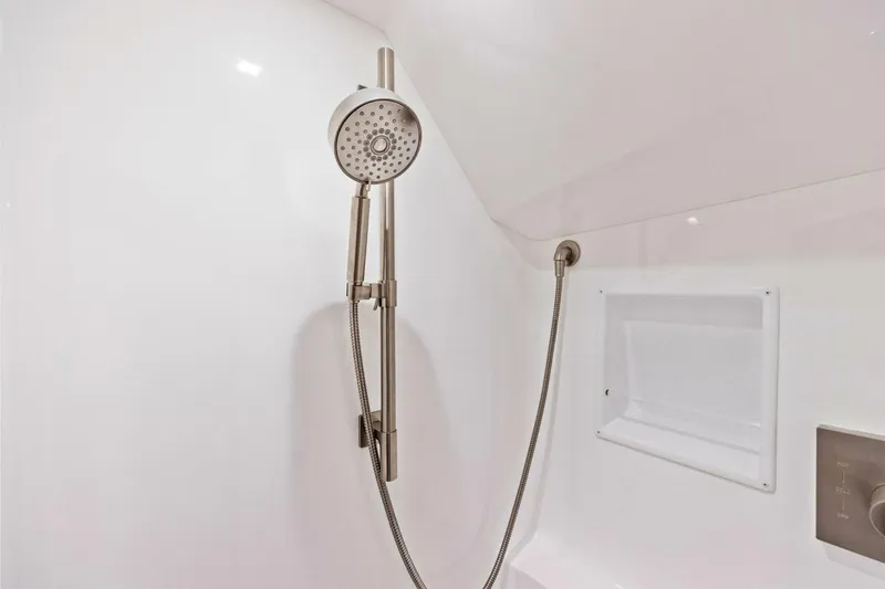Team Harvey Yacht Photos Pics Modern showerhead in 2026 Viking 82 Convertible yacht bathroom.