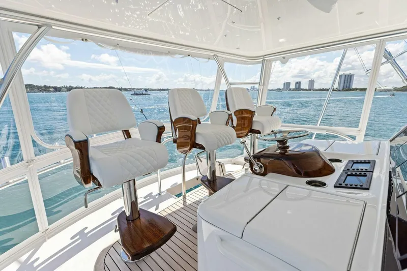 Team Harvey Yacht Photos Pics Luxurious interior of 2026 Viking 82 Convertible yacht with elegant seating and ocean view.