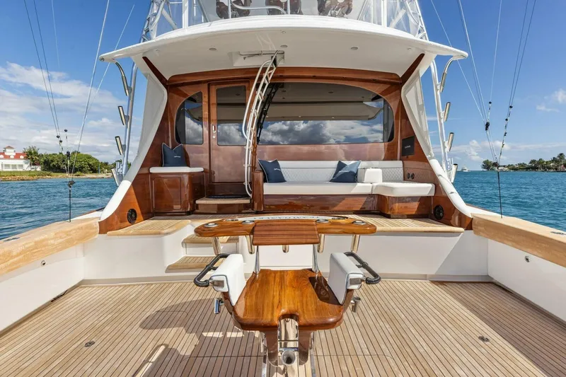 Team Harvey Yacht Photos Pics Luxurious 2026 Viking 82 Convertible yacht with elegant wooden deck and seating area.