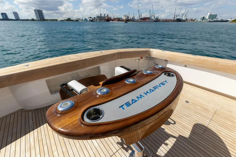 Team Harvey Yacht Photos Pics 2026 Viking 82 Convertible yacht deck with "Team Harvey" fishing station, ocean view.