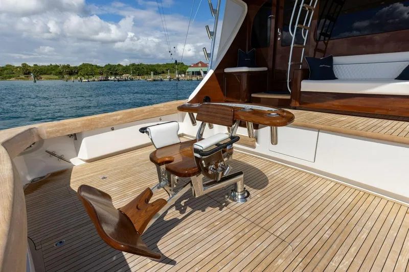 Team Harvey Yacht Photos Pics 2026 Viking 82 Convertible yacht deck with fishing chair and wooden flooring.
